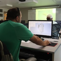 Student working on a computer in a classroom.